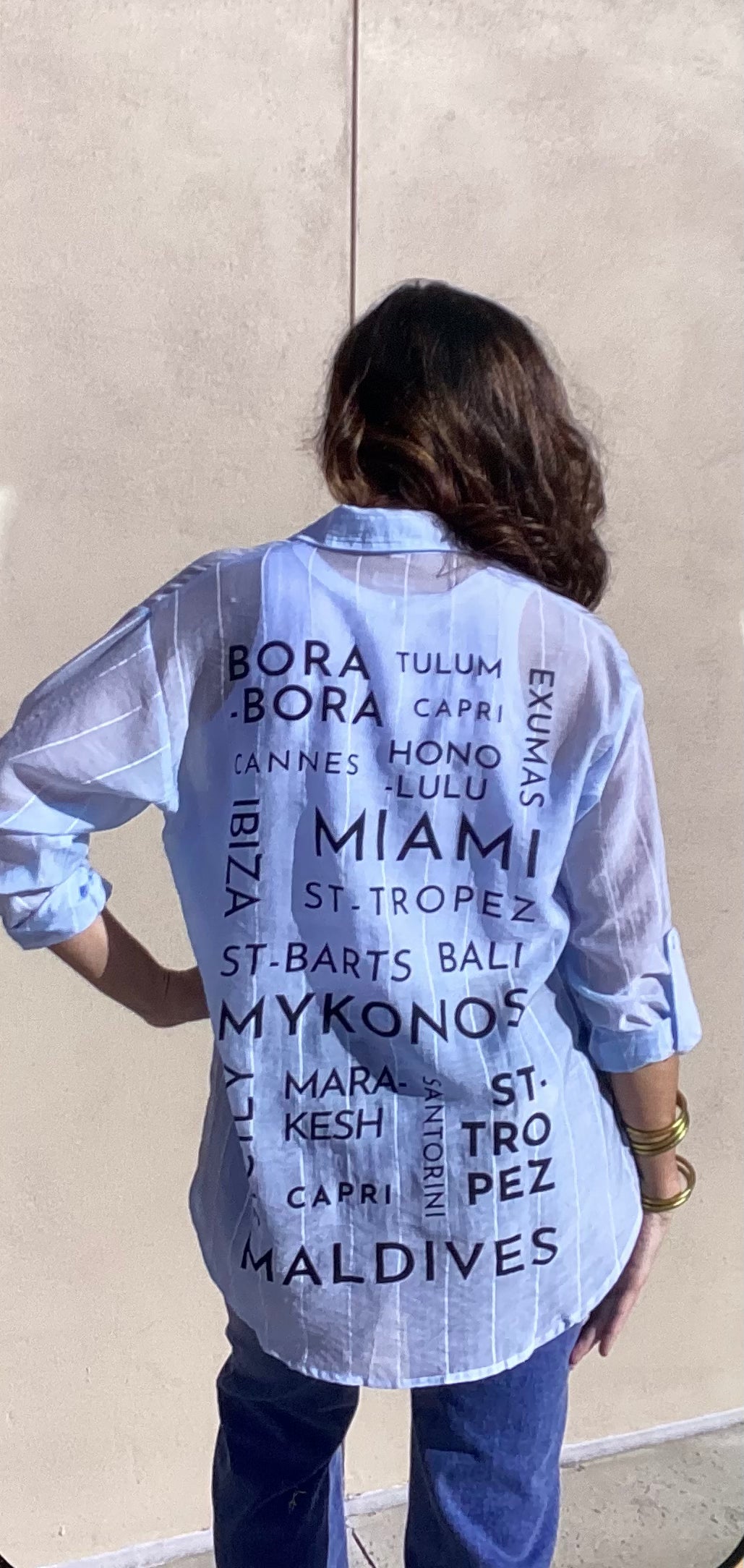 Elan button down cover up with wording on back