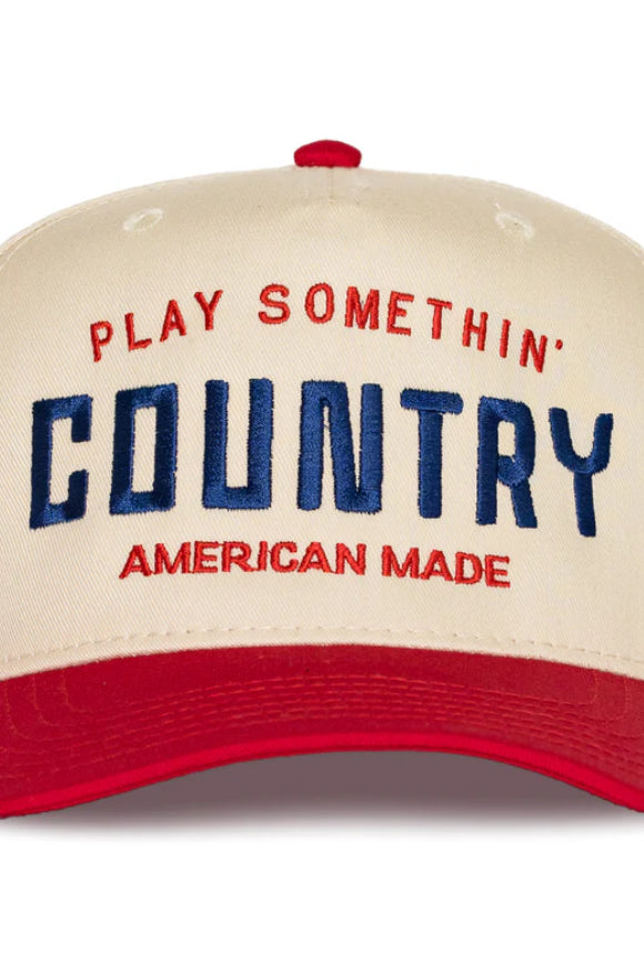 Beige cap with red and blue text on a white background