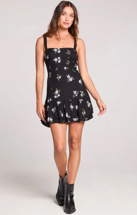 Saltwater Luxe Carleigh Mini Dress. Black with floral print. Flounce skirt.