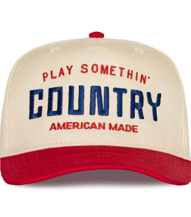 Beige cap with red and blue text on a white background